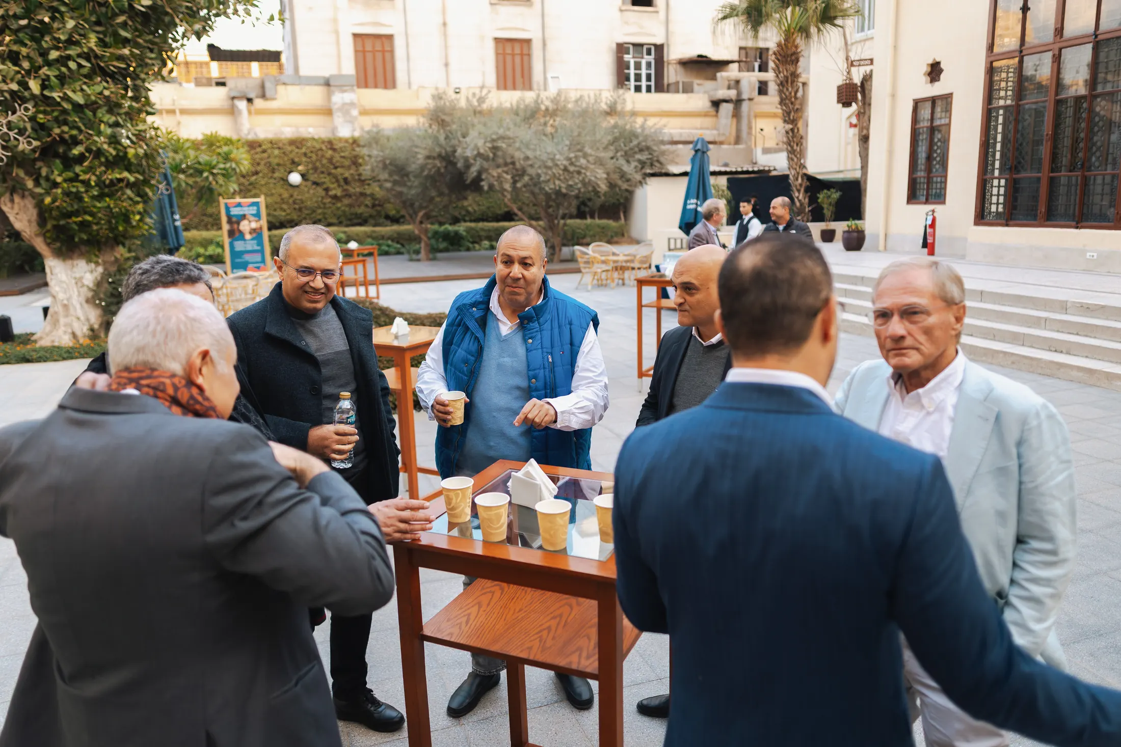PGAE alumni catching up over coffee at a reunion gathering in Cairo.